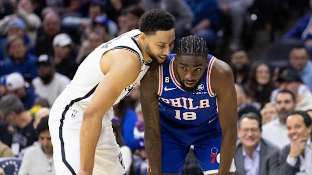 Nets forward Ben Simmons defends 76ers guard Shake Milton